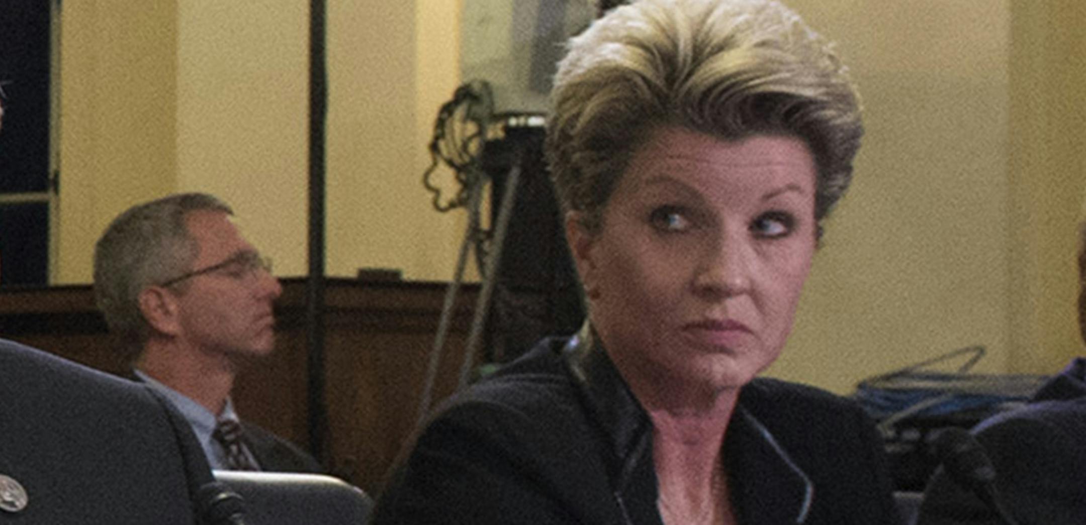 FILE - In this Nov. 2, 2015, file photo, Veterans Affairs Department St. Paul Regional Office Director Kimberly Graves listens during a hearing on Capitol Hill in Washington. A judge has overturned a decision by the Veterans Affairs Department to demote a senior official accused of manipulating the agency's hiring system for her own gain. The VA's acting inspector general said Graves and another senior executive, Diana Rubens, forced lower-ranking managers to accept job transfers and then steppe
