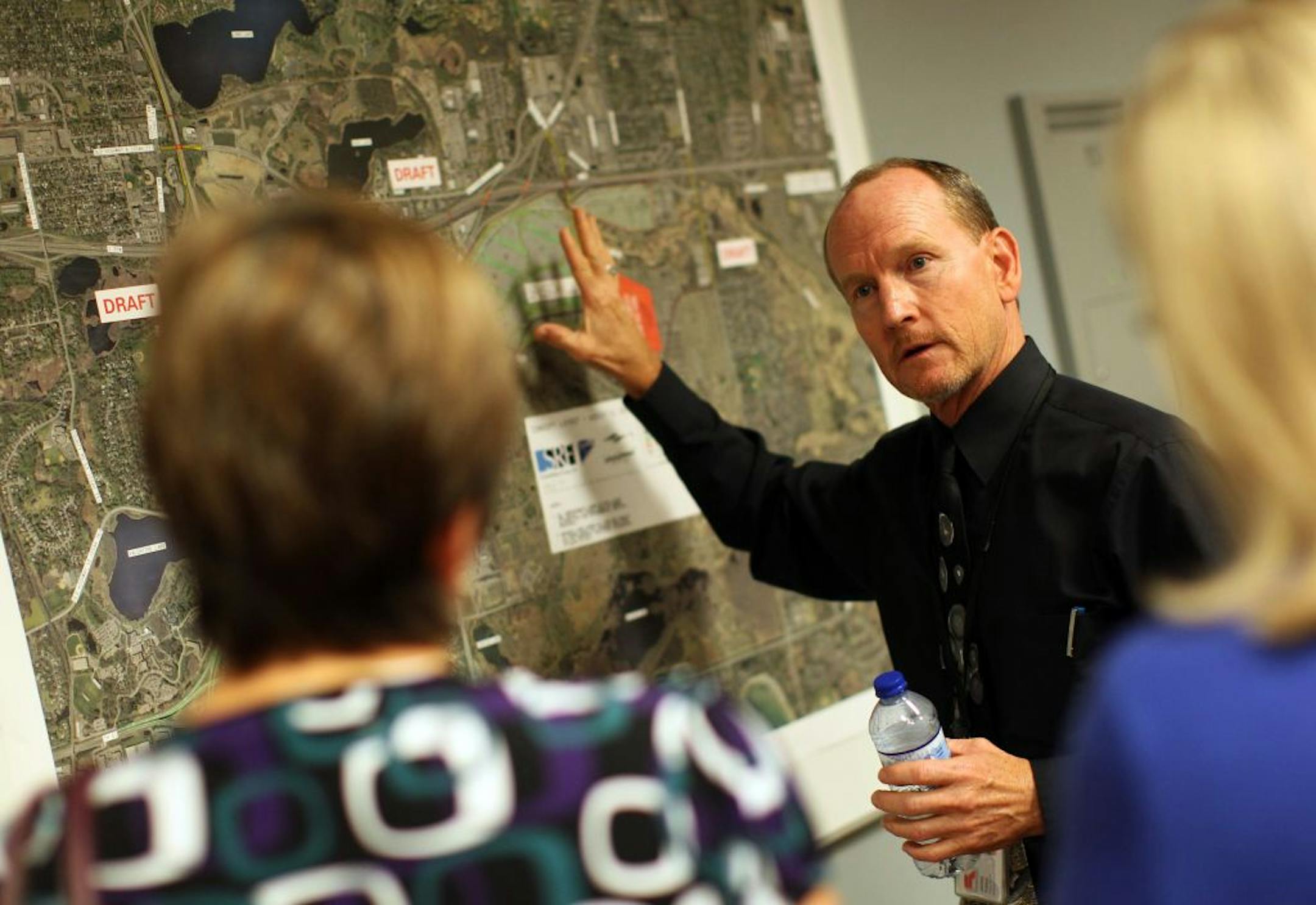 Ramsey County Engineer James Tolaas explained at Thursday's open house how traffic around a Vikings stadium in Arden Hills would work. Lyle Salmela, who lives nearby, wasn't so worried. "If we can move 100,000 people to the State Fair for 12 days … we should be able to move 100,000 here on nonpeak hours."