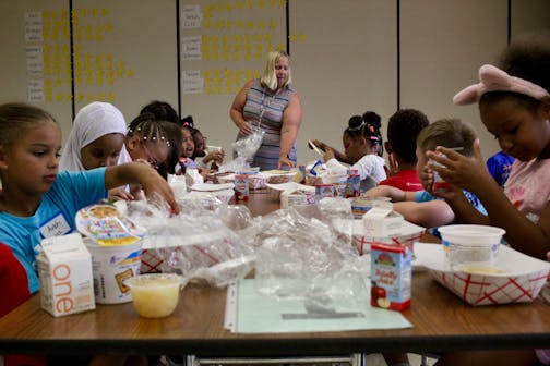 First-graders get situated during breakfast at Hidden Valley Elementary in Savage. This is the first year all students will eat for free after the Minnesota Legislature passed a universal school meals bill in May.