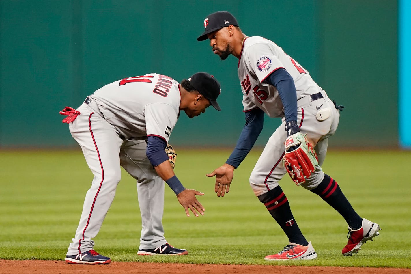 Minnesota Twins' Jorge Polanco, left, and Byron Buxton celebrate after defeating the Cleveland Indians 5-2 in a baseball game, Monday, Sept. 6, 2021, in Cleveland. (AP Photo/Tony Dejak)