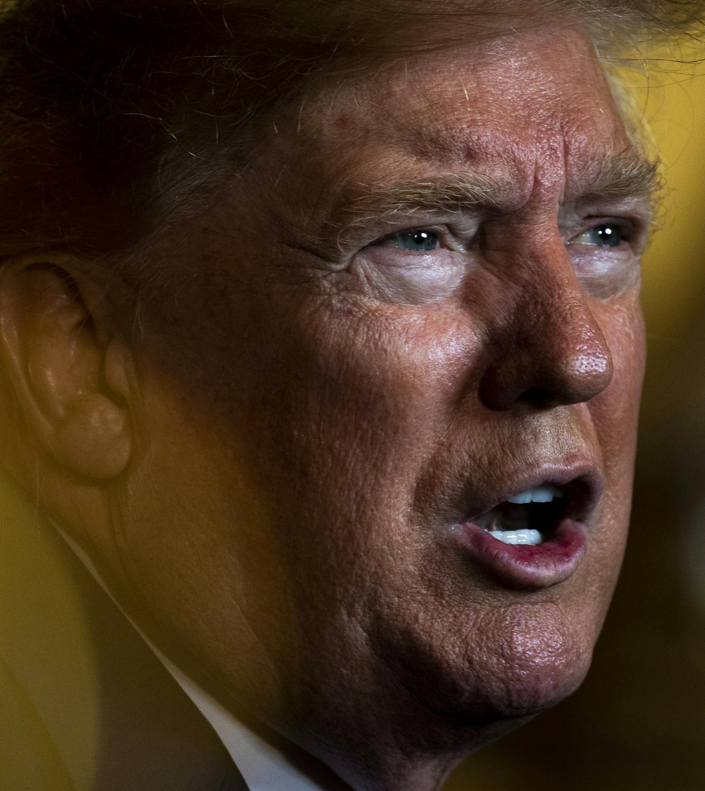 President Donald Trump speaks with reporters following video teleconference with military members on Tuesday, Dec. 24, 2019, at his Mar-a-Lago resort in Palm Beach, Fla. (Anna Moneymaker/The New York Times)