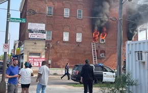 Fire torches a three story apartment building in St. Paul, where 14 residents were displaced and three people were hospitalized with minor injuries.