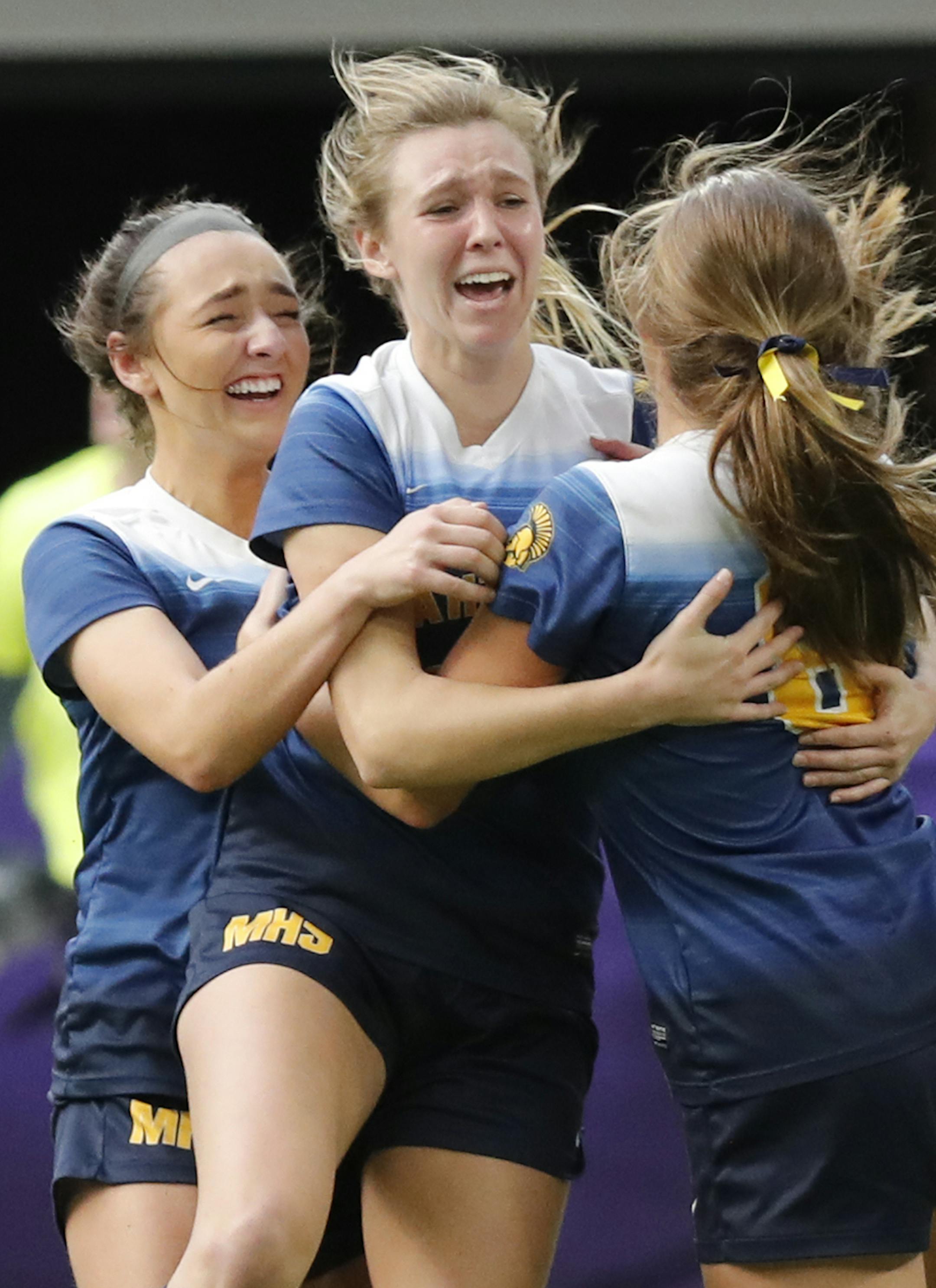 Mahtomedi High School forward Sonia Meyer (14), center, celebrates after scoring the game winning goal in overtime. ] LEILA NAVIDI • leila.navidi@startribune.com BACKGROUND INFORMATION: Mahtomedi High School plays against Orono High School in the Class A Girls Soccer State Championship game at U.S. Bank Staidum in Minneapolis on Friday, November 2, 2018. Mahtomedi High School won in overtime 1-0.