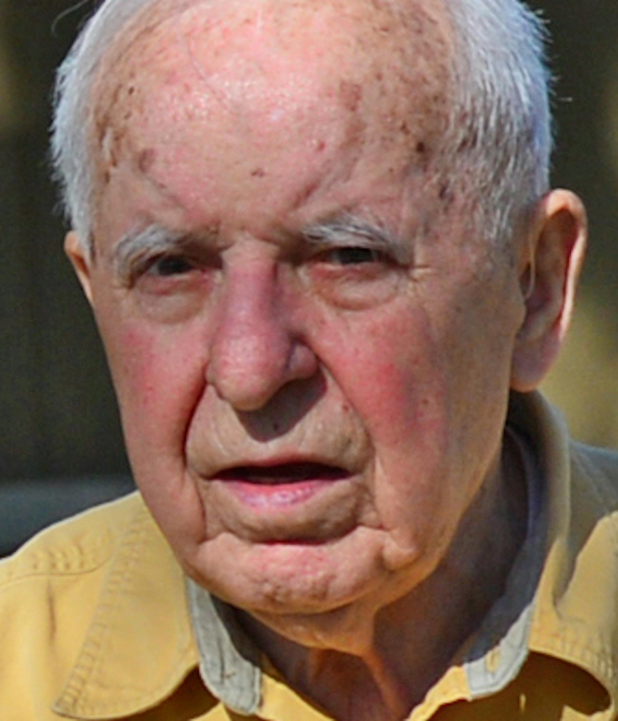 Michael Karkoc spent some time working in his yard in Minneapolis, Minn on Friday May, 23 2014.] They drive by his house day after day to stare and point and sometimes, snap off a quick photograph. Some circle the block and double back, others shout profanities or slow their car or bicycle just long enough to get a good look at the single-story house where Michael Karkoc lives. All want to know -- who is this 95-year-old Ukrainian immigrant who has long called northeast Minneapolis home? Is he t