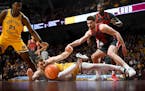 Gophers forward Parker Fox (23) forced a turnover against Ohio State's Jamison Battle (10) on Thursday at Williams Arena.