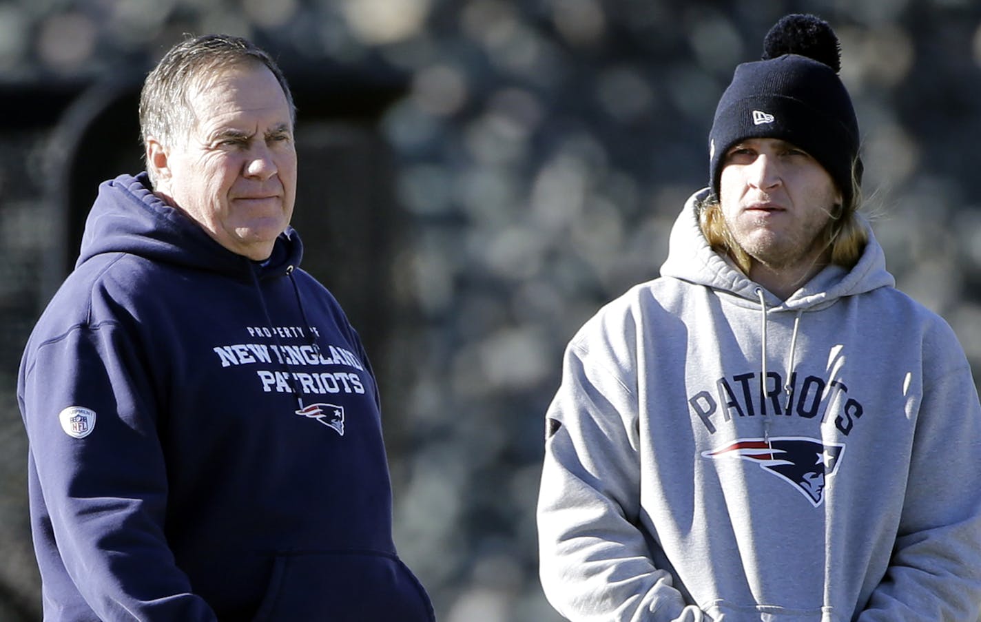 New England Patriots head coach Bill Belichick, left, watches his players along with his son, safeties coach Steve Belichick, during NFL football practice, Wednesday, Jan. 11, 2017, in Foxborough, Mass. (AP Photo/Elise Amendola) ORG XMIT: MAEA101