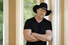 In this May 13, 2013 photo, country singer Trace Adkins and Maureen Maltez rehearse in Brentwood, Tenn. Atkins recently heard Maltez sing at his daugh