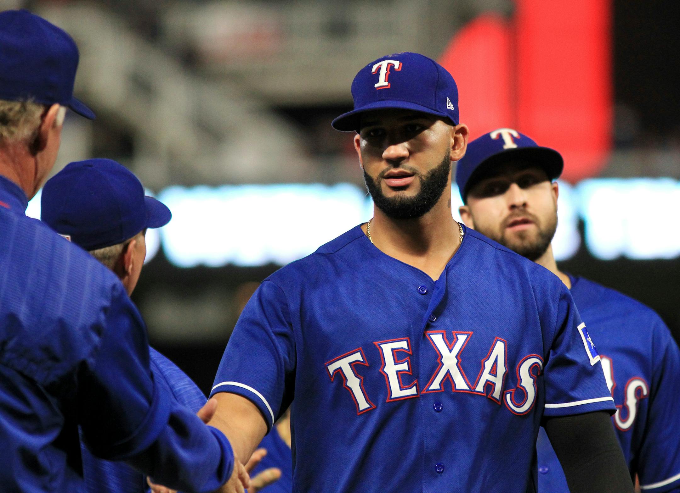 Texas Rangers right fielder Nomar Mazara (30) is congratulated after a win over the Minnesota Twins in a baseball game on Saturday, Aug. 5, 2017, in Minneapolis. (AP Photo/Andy Clayton-King)