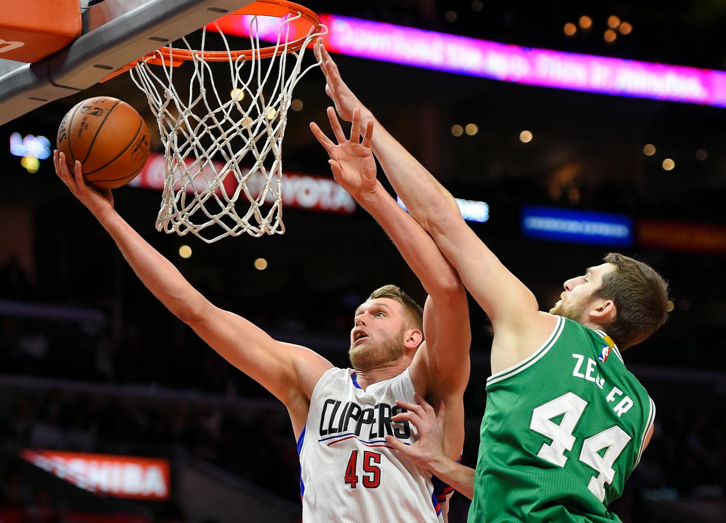 Los Angeles Clippers center Cole Aldrich, left, shoots as Boston Celtics center Tyler Zeller defends during the second half of an NBA basketball game, Monday, March 28, 2016, in Los Angeles. The Clippers won 114-90. (AP Photo/Mark J. Terrill)