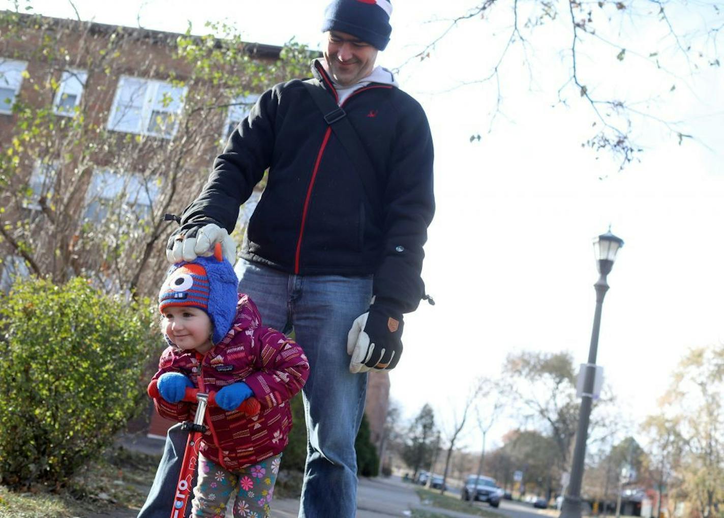 Neil Gunn, who lives near the former Ford site, was out for a walk in the neighborhood with his daughter, Alyth, 2, Tuesday, Nov. 12, 2019, in St. Paul, MN. Earlier that day at a press conference, it was announced that a nearly billion dollar investment proposal was launched for the former Ford Site in affordable housing, parks and infrastructure over the next two decades at the site Tuesday, Nov. 12, 2019, in St. Paul, MN. Gunn said he would like to see the redevelopment include a great deal of