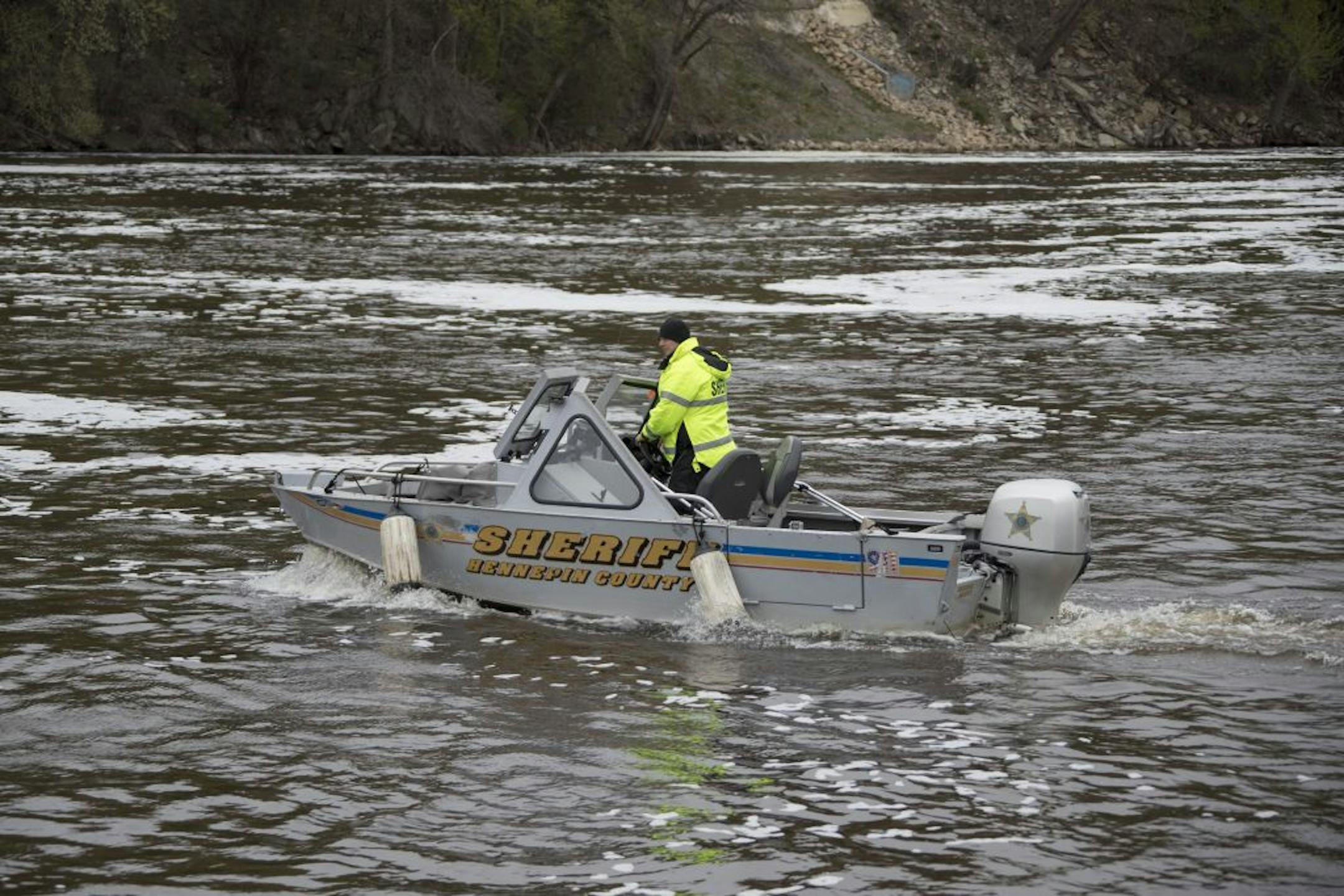 A deputy from the Hennepin County Sheriff's office continued searching for 22-year-old Chris Stanley in the Mississippi River near Bohemian Flats Thursday April 27, 2017 in Minneapolis, MN.