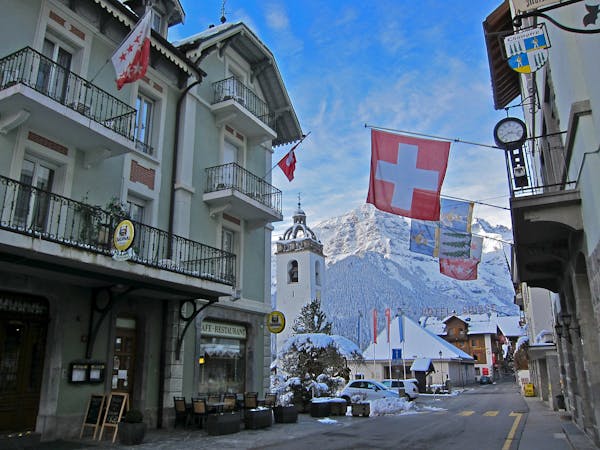 Many 19th-century buildings line the streets of Champ&#x221a;&#xa9;ry, nestled below the mountain peaks known as Dents du Midi.