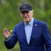 President Joe Biden waves as he walks across the South Lawn of the White House in Washington, Wednesday, April 17, 2024, after returning from a trip t