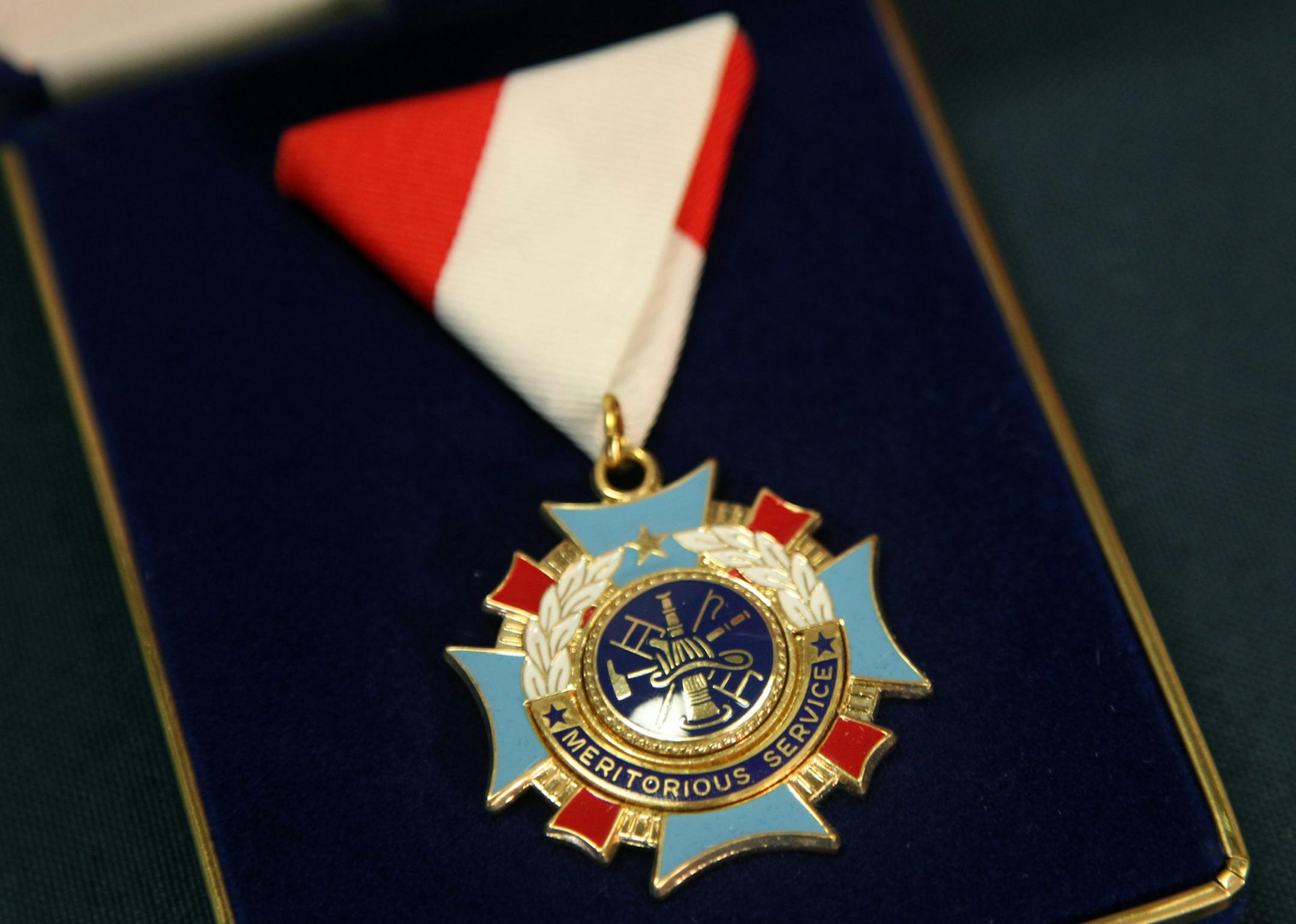 Fire Chief Tim Butler honored Regions Hospital emergency room physician Dr. R.J. Frascone for helping save the life of a 17 year old fire victim on January 31, 2013, during a small ceremony at Fire Station 7 in St. Paul, MN, Tuesday, February 26, 2013. (ELIZABETH FLORES/STAR TRIBUNE) ELIZABETH FLORES • eflores@startribune.com