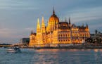 The House of Parliament, fronting the Danube River in Budapest, Hungary, seems every bit the fairy castle when seen at sunset from the deck of the Sce