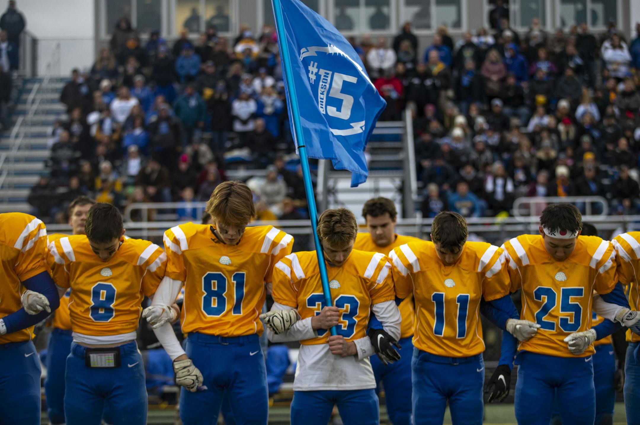 Sophomores on the Esko High School football team linked arms and bowed their heads in a moment of silence to honor Jackson Pfister, who was also a sophomore. ]
ALEX KORMANN • alex.kormann@startribune.com The Esko High School football team played their first game since sophomore Jackson Pfister died suddenly during their last game due to congenital heart disease. A small memorial was set up by the field and a moment of silence was observed before the national anthem on Wednesday October 16