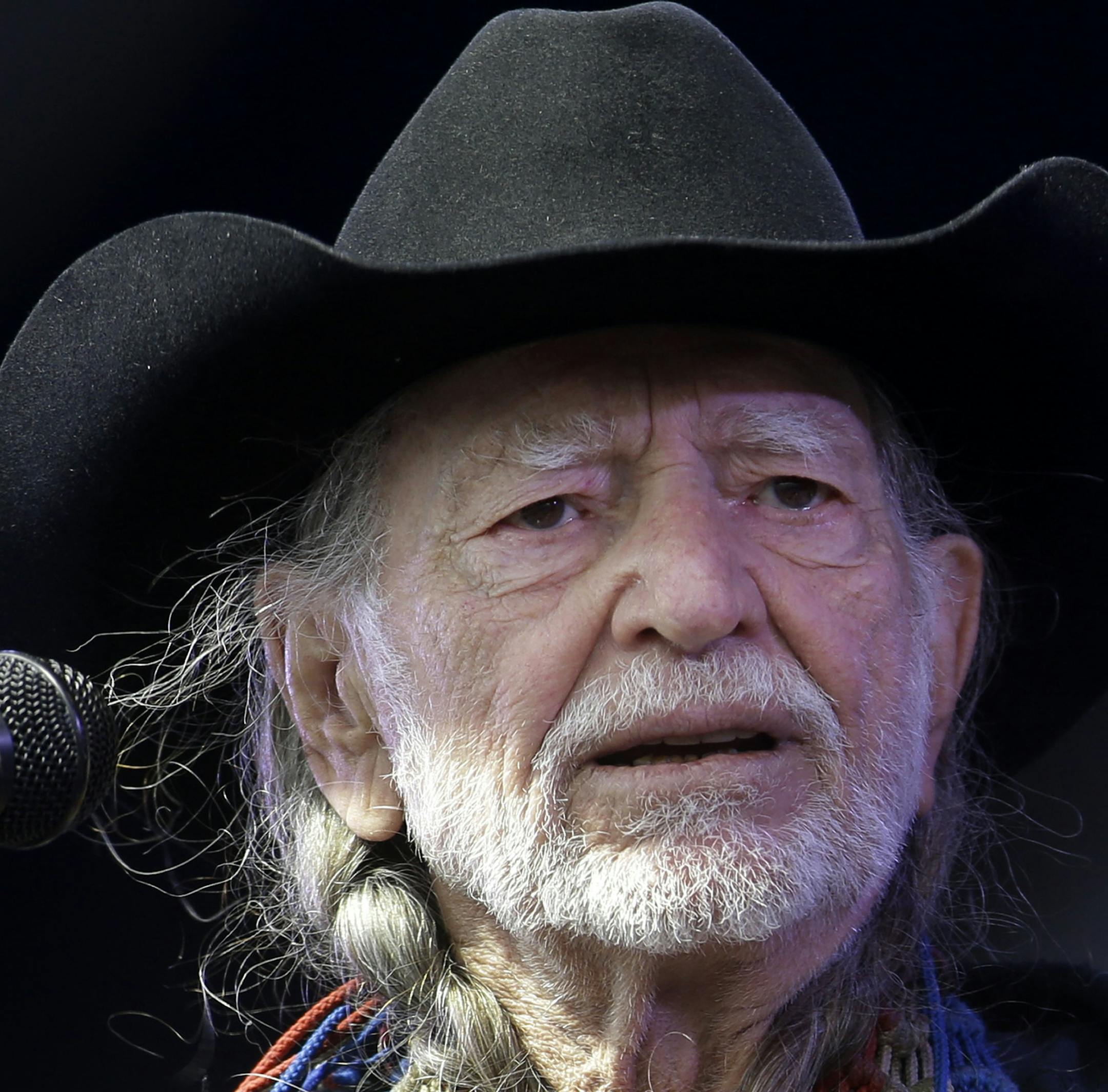 Willie Nelson performs at the New Orleans Jazz and Heritage Festival in New Orleans, Friday, May 3, 2013. (AP Photo/Gerald Herbert)