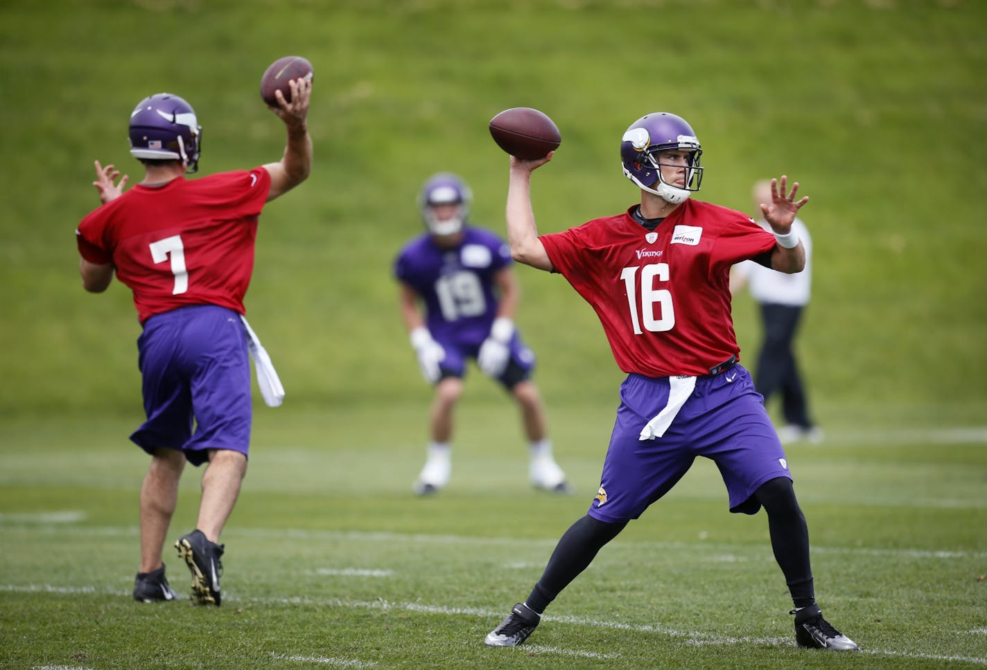 Vikings OTA's organized team activities. Vikings qurterbacks Matt Cassel and Christian Ponder go through the motions at practice.