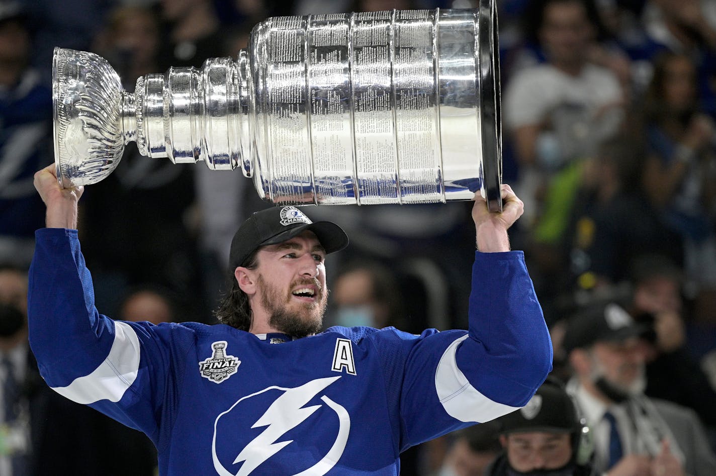 Tampa Bay Lightning defenseman Ryan McDonagh hoists the Stanley Cup after getting the win over the Montreal Canadiens in Game 5 of the NHL hockey Stanley Cup finals series, Wednesday, July 7, 2021, in Tampa, Fla. (AP Photo/Phelan M. Ebenhack)