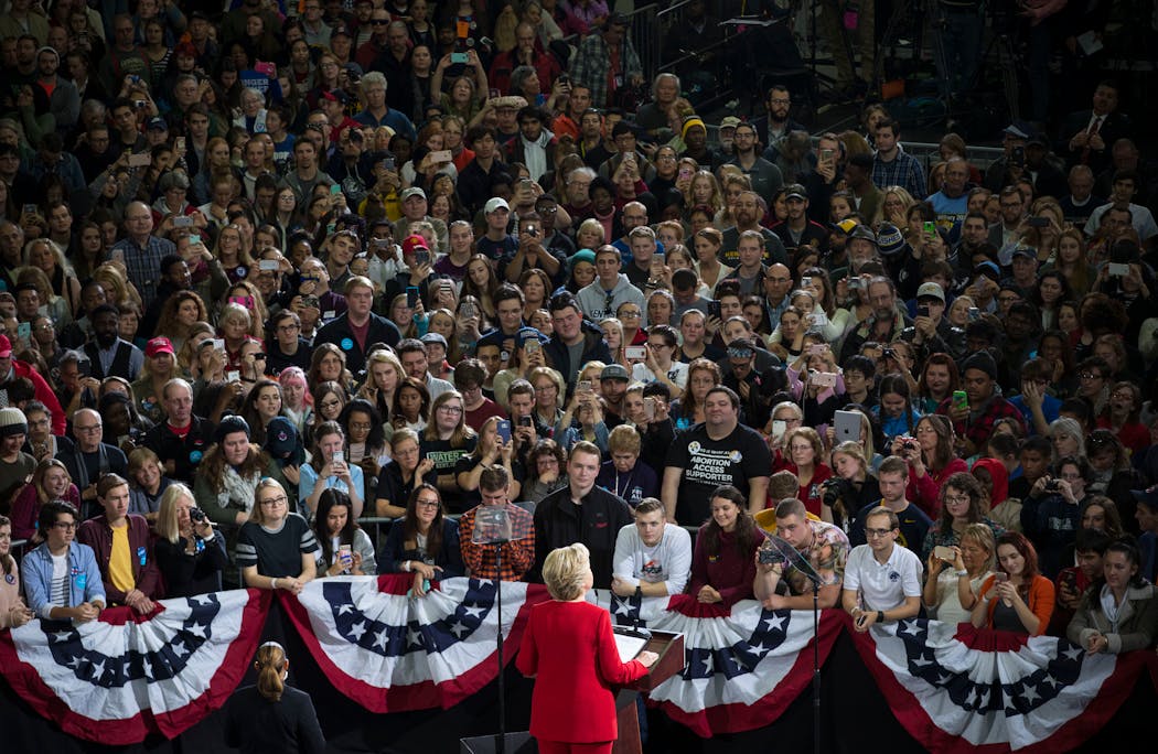 Supporters look on as Hillary Clinton speaks during a campaign rally at Kent State University in Kent, Ohio, Oct, 31, 2016.