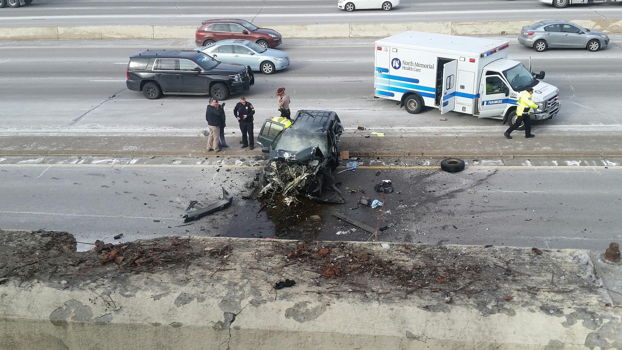 This SUV crashed through a wall and landed on Interstate 394 on Wednesday, killing one person.