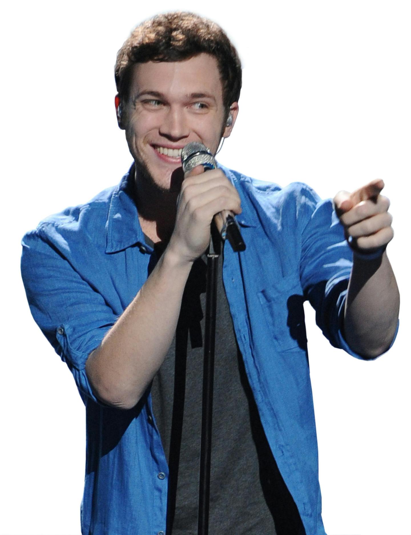 In this May 9, 2012 file photo provided by Fox, contestant Phillip Phillips performs on the singing competition series "American Idol," in Los Angeles. With the eleventh season finale of "American Idol" just a week away, many fans of the Fox talent contest aren't wondering who will capture the title, but whether sassy 16-year-old diva-in-training Jessica Sanchez or booming 20-year-old vocal showstopper Joshua Ledet would even have the votes to beat bluesy 21-year-old front-runner Phillip Phillip