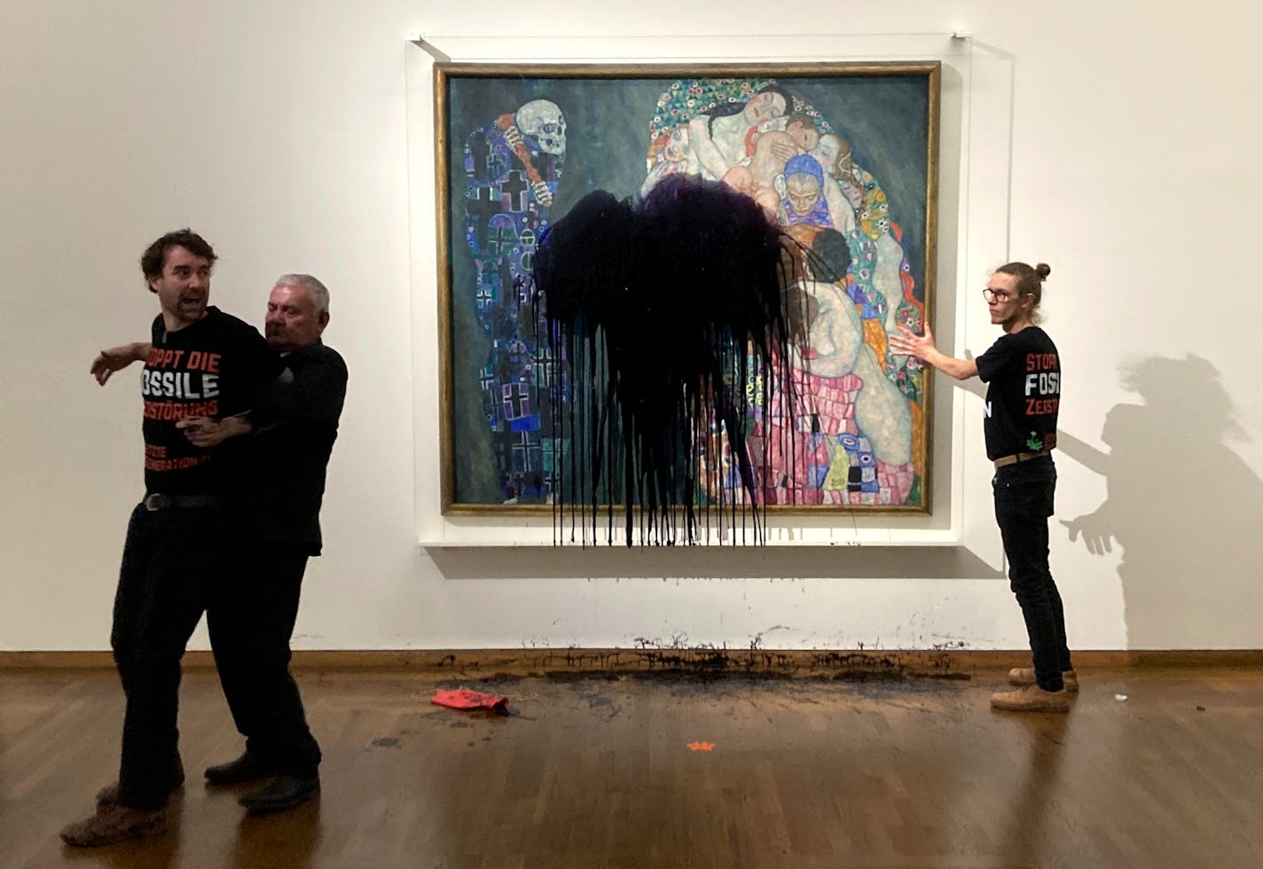 Austrian activists of "last generation Austria" have splashed a Gustav Klimt painting with oil in the Leopold museum in Vienna, Austria, Tuesday, Nov.15, 2022. The painting is behind a glass cover and was unharmed. (AP Photo/Letzte Generation Oesterreich)