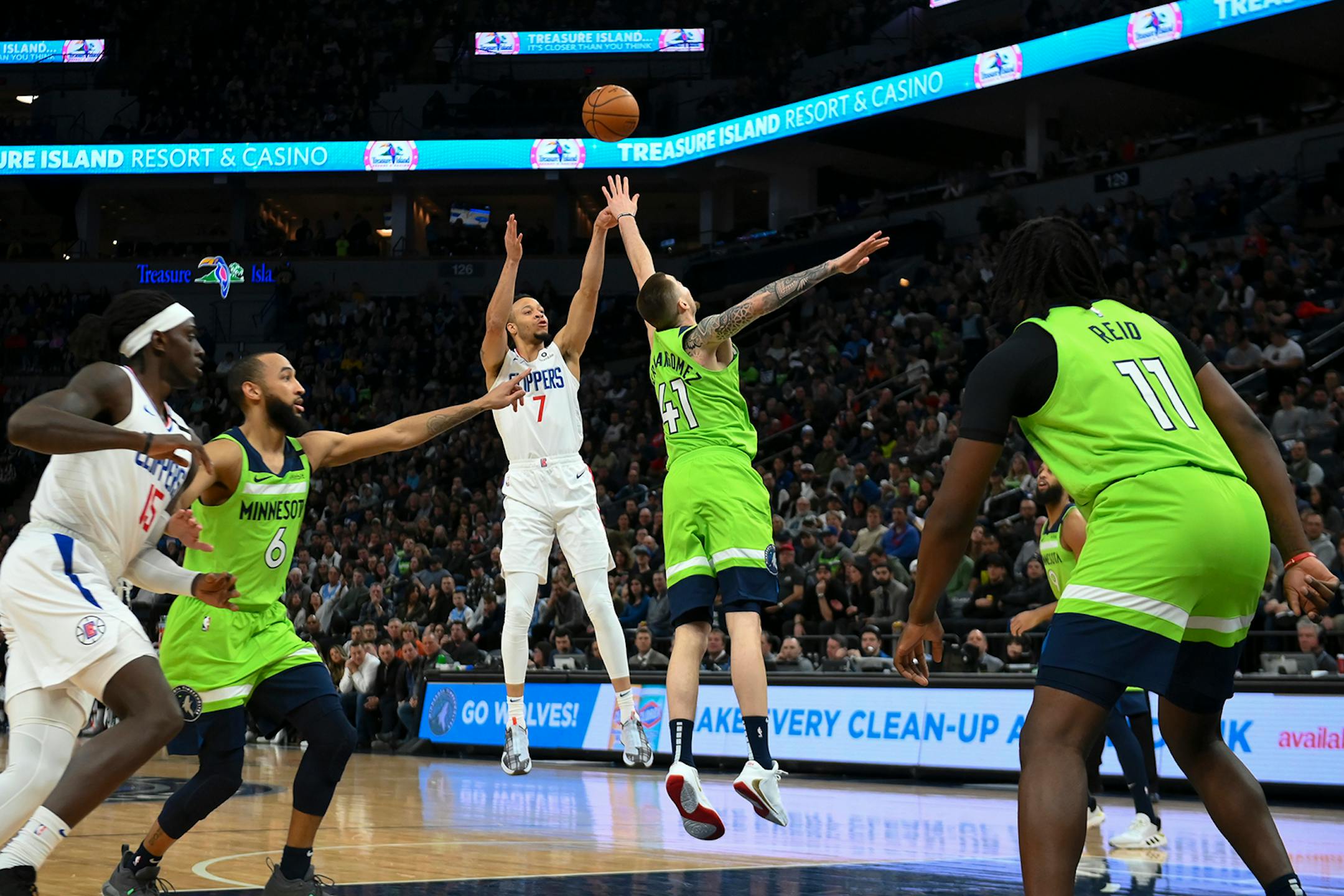 LA Clippers guard Amir Coffey (7), a former standout player from the Gophers, scored a 3-pointer over Minnesota Timberwolves forward Juan Hernangomez (41) in the second half.