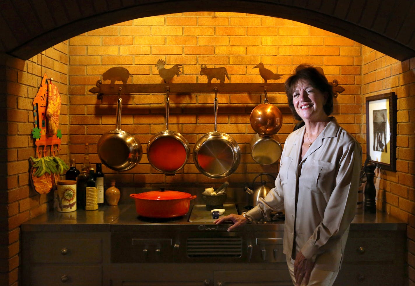 Interior designer Talla Skogmo re-creates the portrait of her mother, Georgia Skogmo, an accomplished homemaker, who appeared with her Chambers cooktop in a 1964 Minnegasco ad.