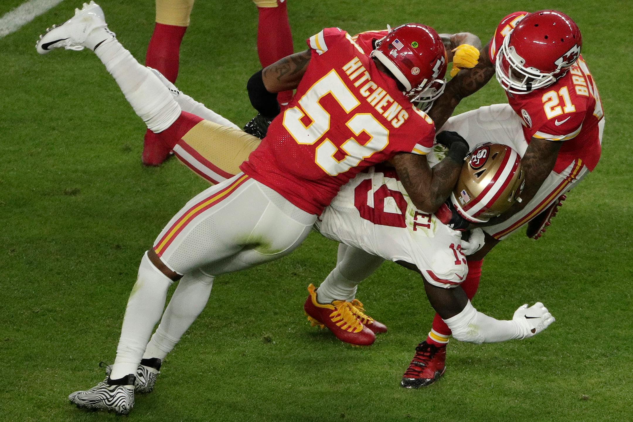 San Francisco 49ers' Deebo Samuel (19) is stopped by Kansas City Chiefs' Anthony Hitchens (53) and Bashaud Breeland (21), during the first half of the NFL Super Bowl 54 football game, Sunday, Feb. 2, 2020, in Miami Gardens, Fla.