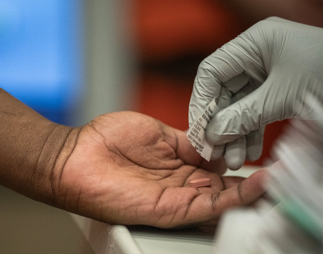 An inmate receives medication at the Hennepin County jail in Minneapolis.