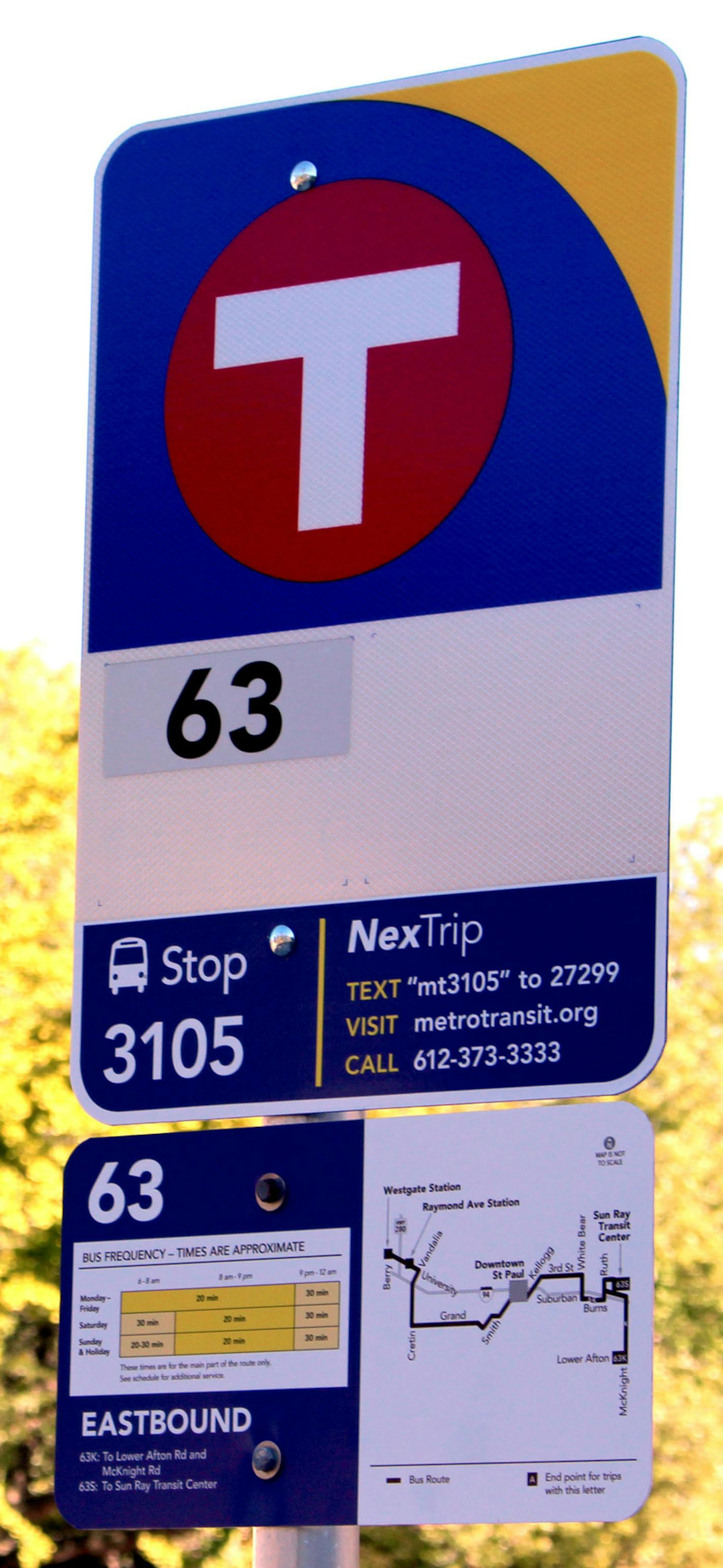 A new bus sign as seen Tuesday on Grand Avenue, where the first of 12,000 new bus signs were installed on Tuesday. New signs inform riders about route maps, bus frequencies and stop numbers. ] ERIC ROPER/STAR TRIBUNE ORG XMIT: MIN1510131523250320