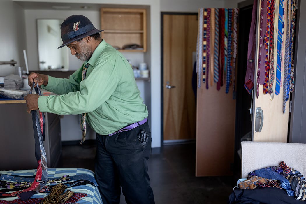 “I thought I’d won a million dollars,” said Roland Arnold after he had been given a key to his new apartment at Catholic Charities Higher Ground St. Paul Residence on Wednesday. Arnold, who sorted his 71 ties, had been homeless since 2007.] Elizabeth Flores • liz.flores@startribune.com