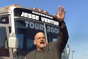 Gov. Jesse Ventura tours SE Minnesota visiting Farmington, Cannon Falls, Zumbrota, Rochester, Chatfield, Winona. --Gov. Ventura waves to a crowd of st
