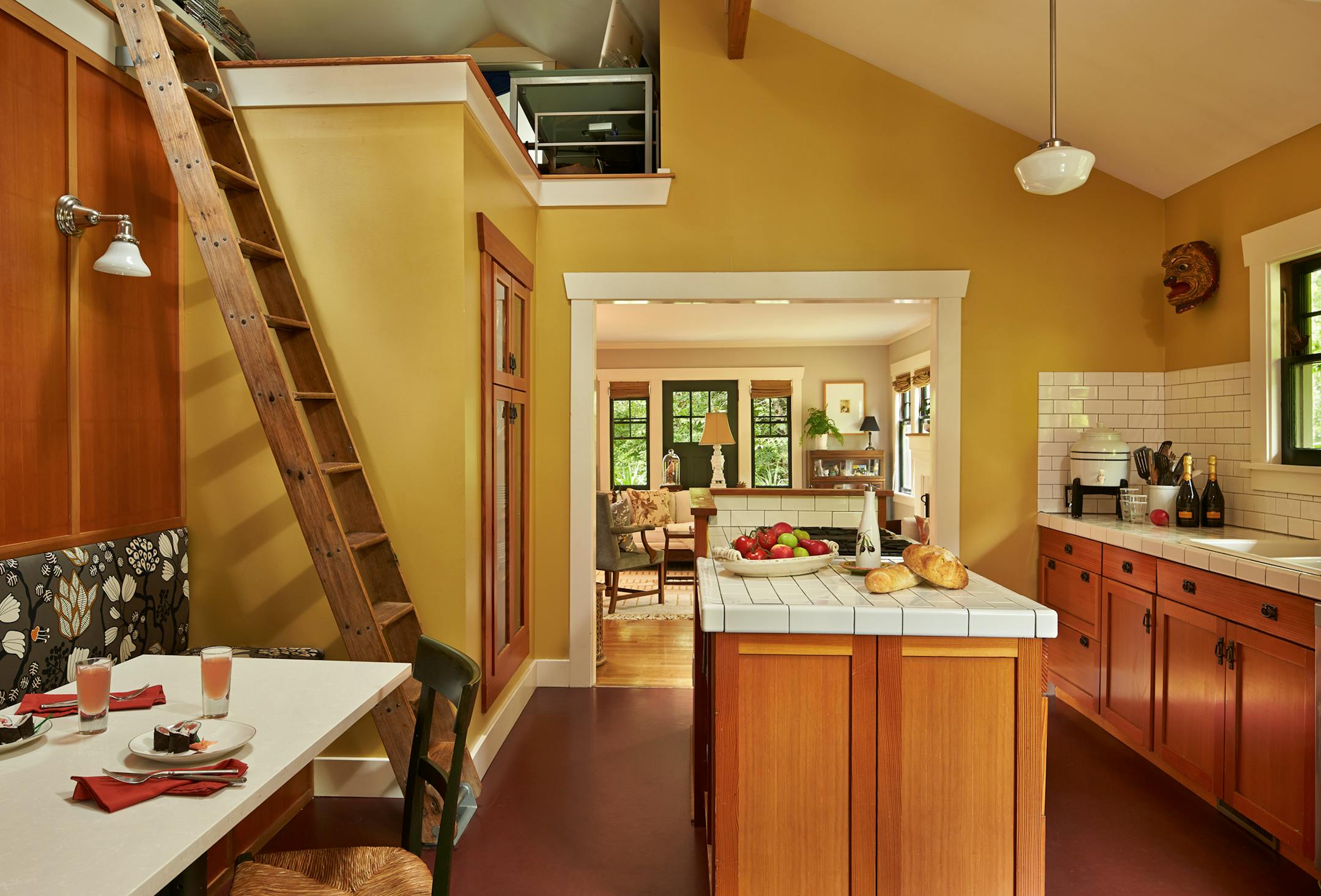 Henry Shepherd and Michelle Burgess moved in when daughter Ava was 1 and Paloma was expected: "When I walked into the kitchen I thought, 'How am I gonna fit two high chairs in with this woodstove in here?'" Out went the woodstove. The ladder leads to Shepherd's office, Ava's bedroom. (Benjamin Benschneider/Seattle Times/MCT)