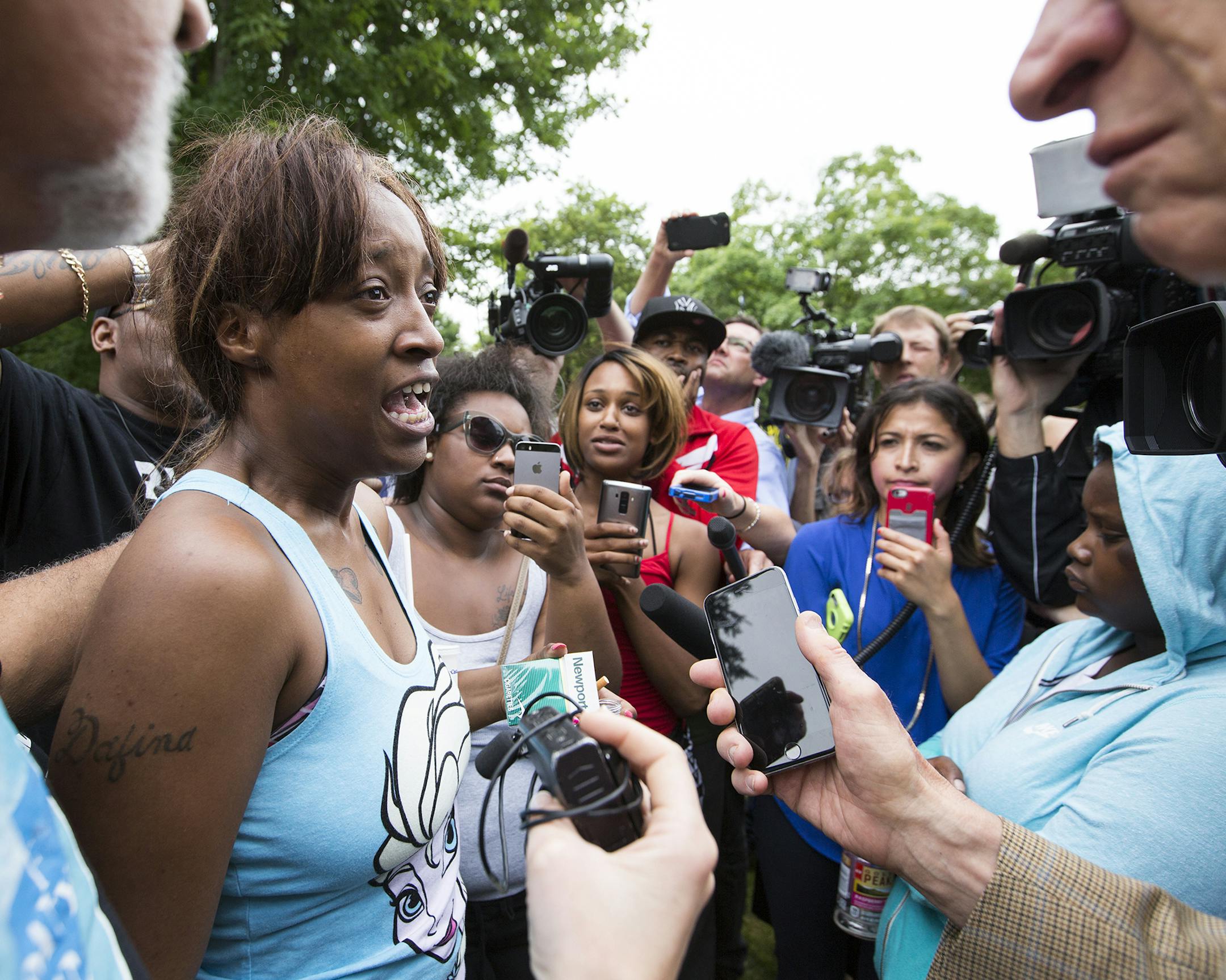 Diamond Reynolds, the girlfriend of Philando Castile, speaks to the crowd and media outside the governor's residence. ] (Leila Navidi/Star Tribune) leila.navidi@startribune.com BACKGROUND INFORMATION: Protesters at the governor's residence in St. Paul on Thursday, July 7, 2016, one day after Philando Castile of St. Paul died after being shot by police in Falcon Heights, the aftermath of which was recorded in a video widely shared on Facebook. ORG XMIT: MIN1607071447302166