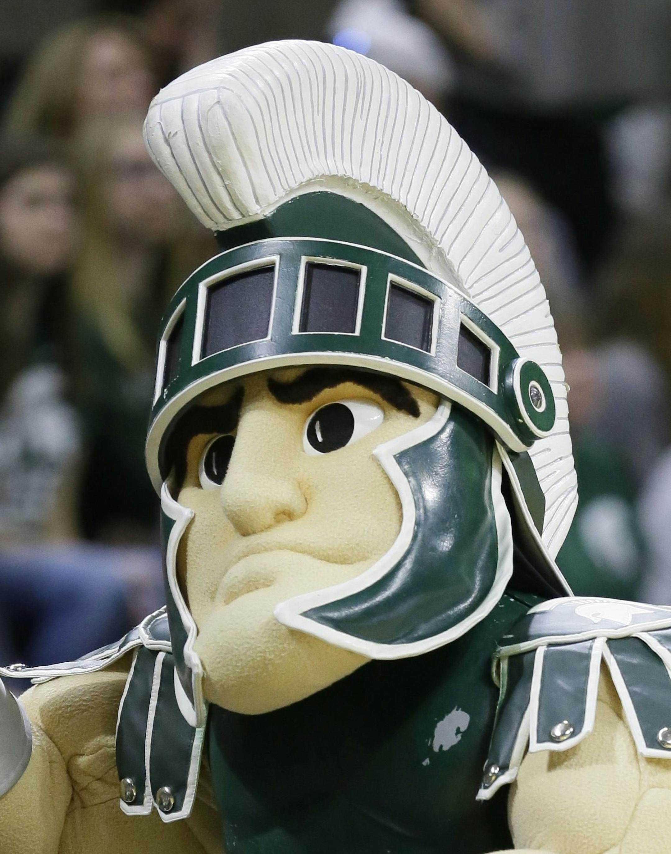 Sparty, the Michigan State mascot, walks the sidelines during the second half of an NCAA college basketball game against Ohio State, Saturday, Feb. 27, 2016, in East Lansing, Mich. (AP Photo/Carlos Osorio)