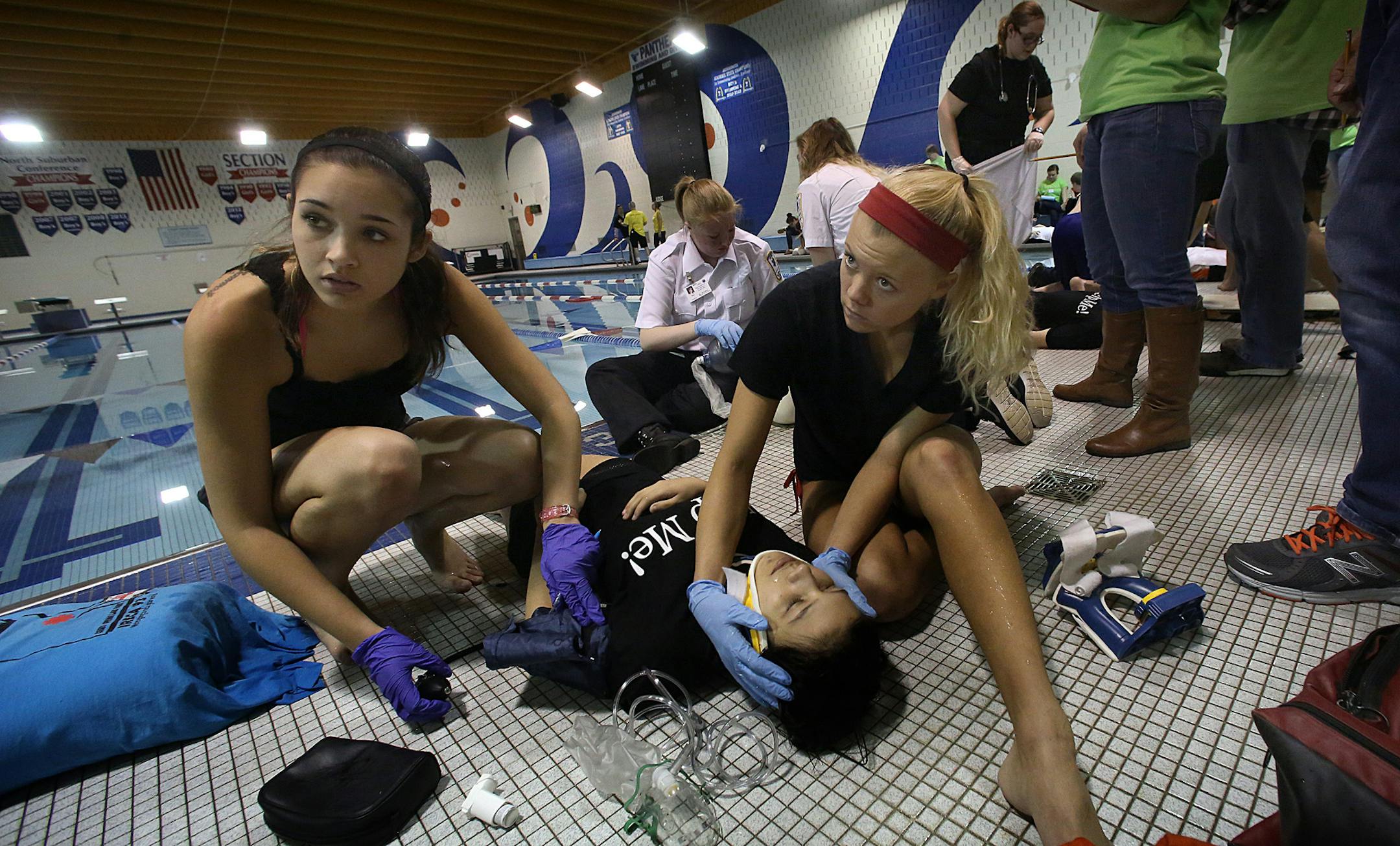 Tori Singh, a junior at Spring Lake Park High School, and teammate Haylee Myren, senior, treated victim Cheyenne Unis, a senior at Blaine, during a drowning scenario. ] JIM GEHRZ ‚Ä¢ jgehrz@startribune.com / Spring Lake Park, MN / February 22, 20134/ 10:30 AM - BACKGROUND INFORMATION: Students compete in the 28th Annual Minnesota State Youth Emergency Care Competition, held at Spring Lake Park High School. Students will use their emergency medical training as they compete in tea