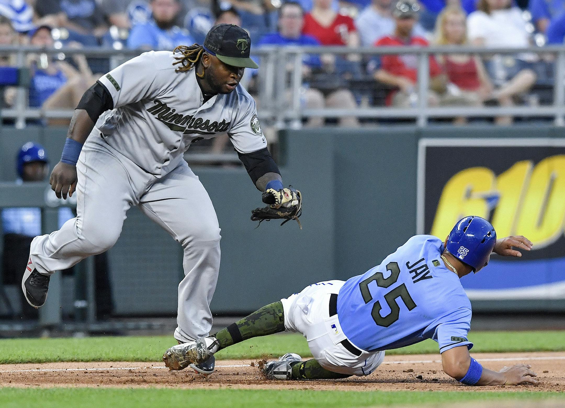 Kansas City Royals' Jon Jay is tagged out by Minnesota Twins third baseman Miguel Sano on a fielders choice hit into by Whit Merrifield in the seventh inning during Monday's baseball game on May 28, 2018, at Kauffman Stadium in Kansas City, Mo. (John Sleezer/Kansas City Star/TNS)