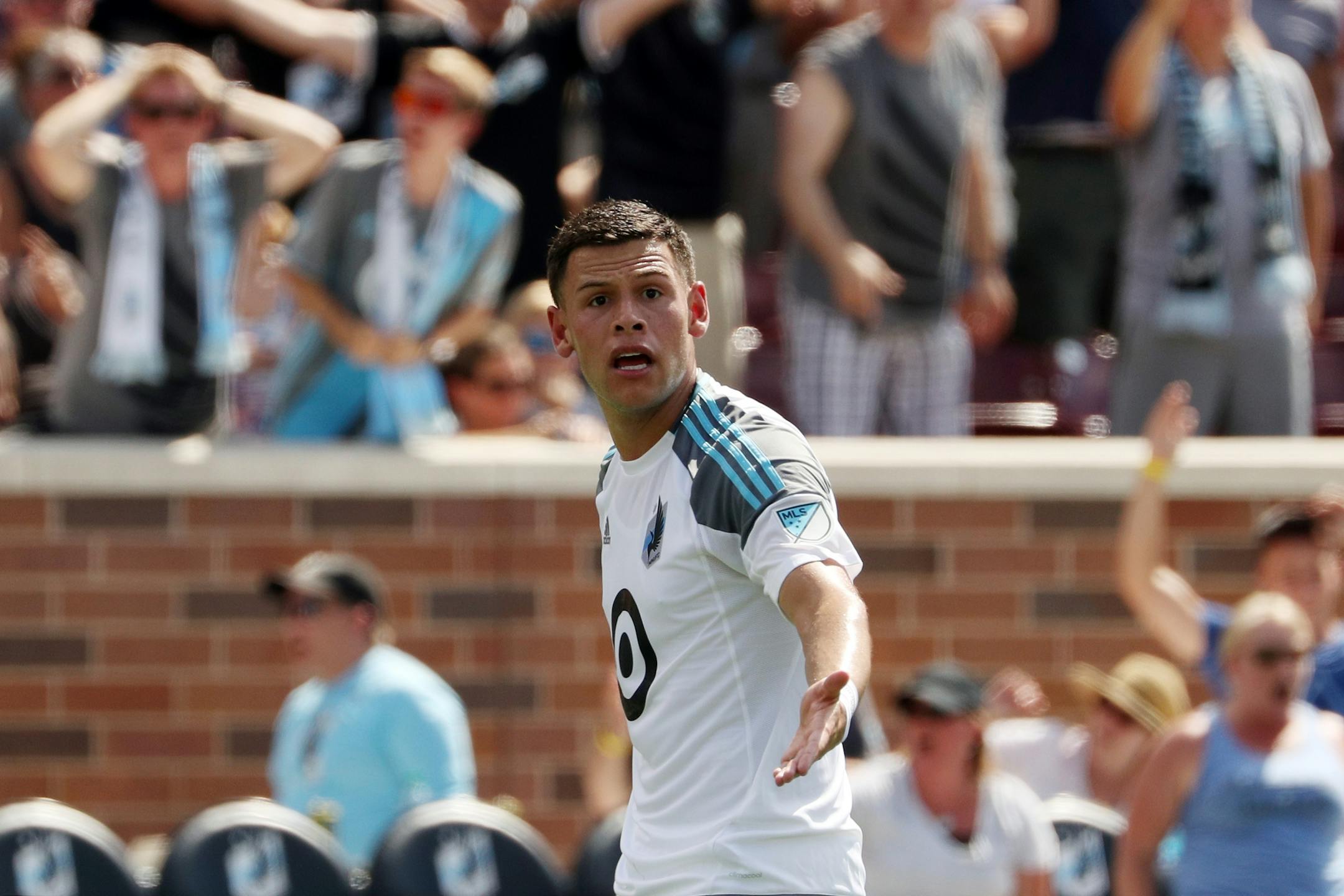 Minnesota United forward Christian Ramirez (21) showed his frustration at not having a foul called after he got tangled up with New York Red Bulls defender Damien Perrinelle (55) near the New York Red Bulls goal in the first half.