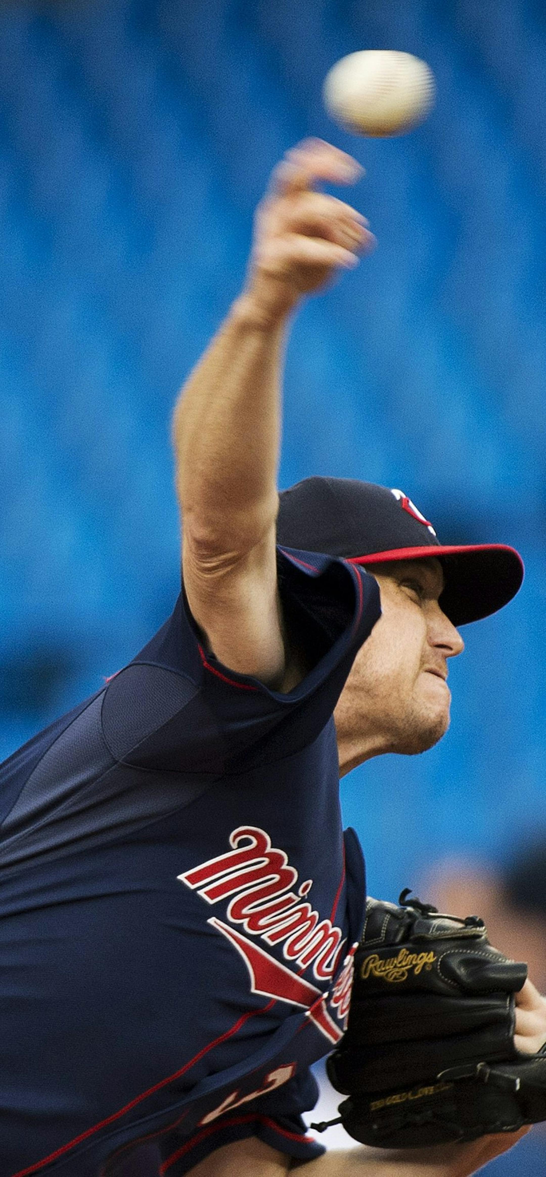 Minnesota Twins starting pitcher Kevin Correia works against the Toronto Blue Jays during the first inning of a baseball game in Toronto on Tuesday, June 10, 2014. (AP Photo/The Canadian Press, Nathan Denette)