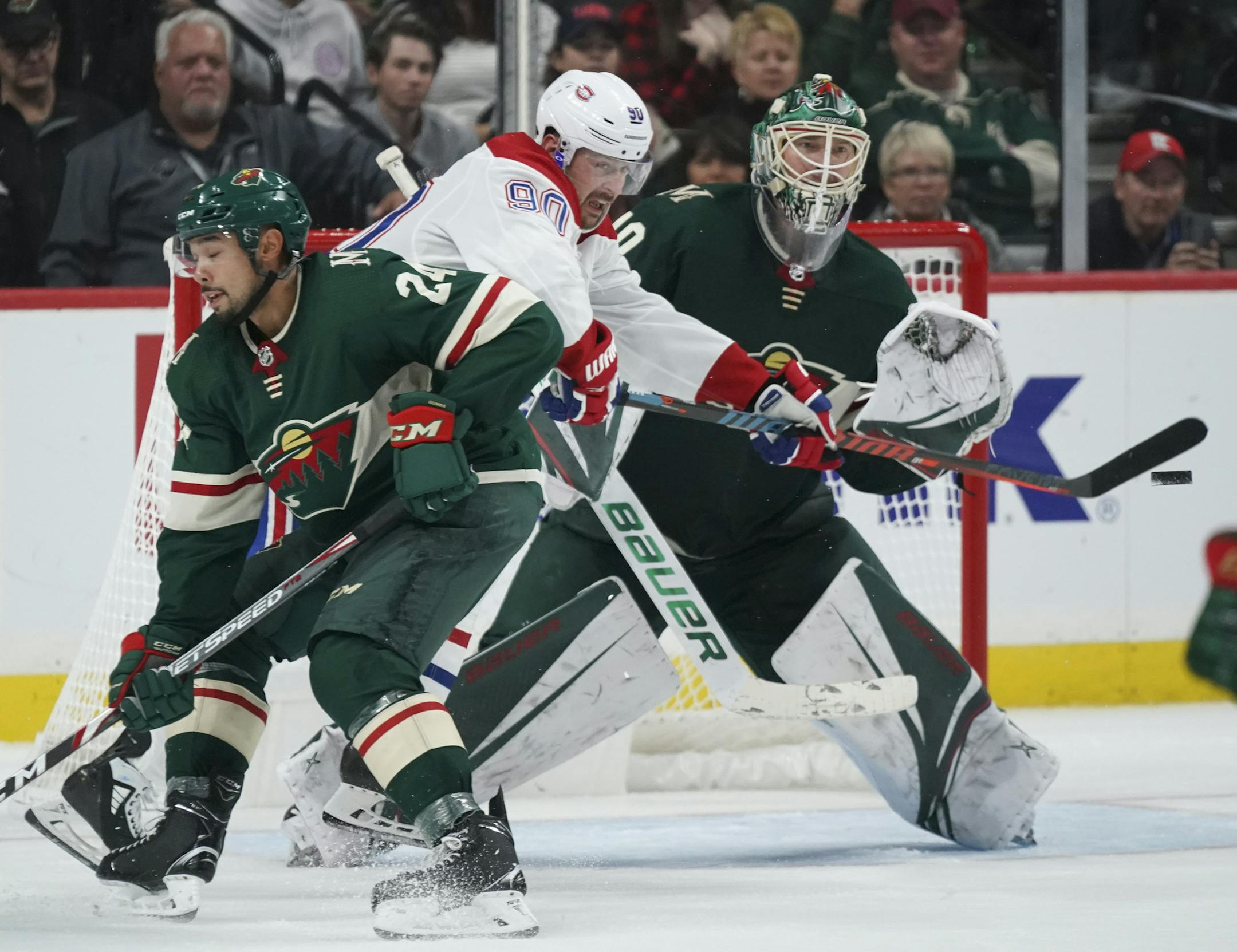 Montreal Canadiens left wing Tomas Tatar (90) tried to deflect an incoming puck in front of Minnesota Wild goaltender Devan Dubnyk (40) while Matt Dumba (24) defended. ] JEFF WHEELER • Jeff.Wheeler@startribune.com The Minnesota Wild defeated the Montreal Canadiens 4-3 in an NHL hockey game Sunday afternoon, October 20, 2019 at Xcel Energy Center in St. Paul.