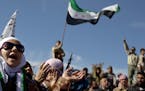 A woman chants anti government slogans during a protest in a town in north Syria, Friday, March 2, 2012. Syria has faced mounting international critic