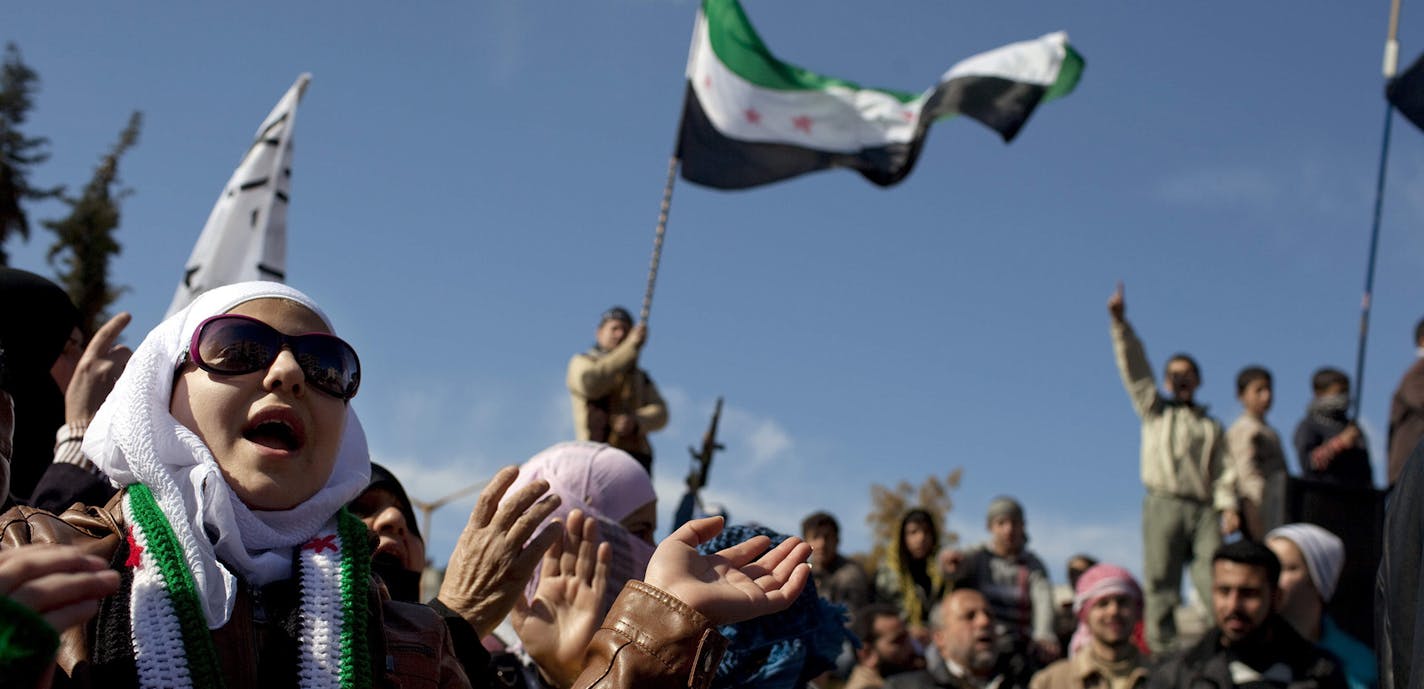 A woman chants anti government slogans during a protest in a town in north Syria, Friday, March 2, 2012. Syria has faced mounting international criticism over its bloody crackdown on the uprising, which started with peaceful protests but has become increasingly militarized. (AP Photo/Rodrigo Abd) ORG XMIT: ABD105