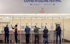 People took to the new saliva COVID-19 testing site at the Minneapolis-St. Paul International Airport, Thursday, November 12, 2020. The airport partne