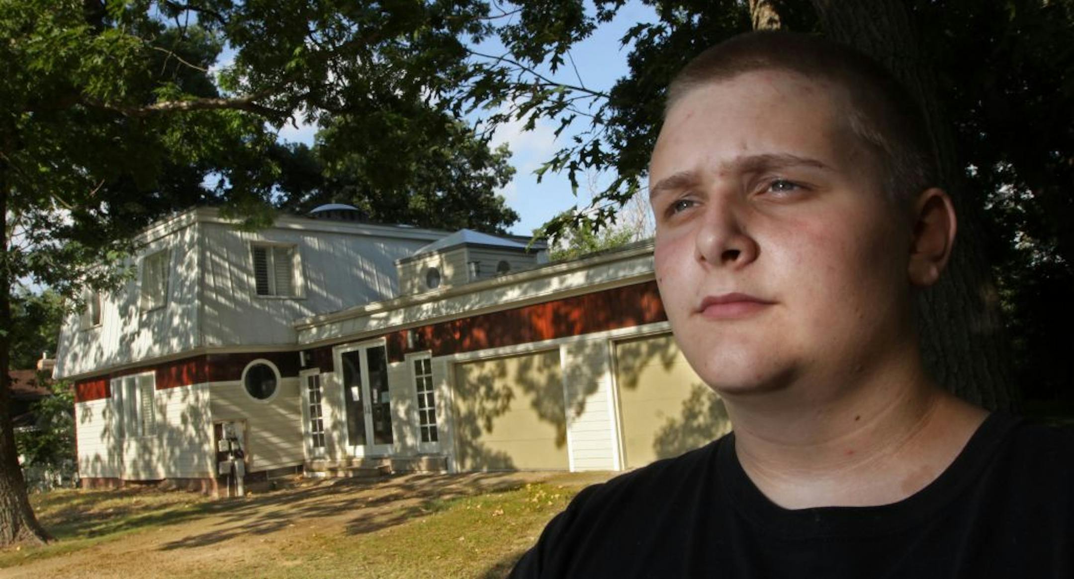 Max Peterson of Lakeville was a close friend of the 11-year-old boy who was left behind by his father, Steven A. Cross. He was photographed infront of the Cross house that was being foreclosed, 8/26/2011.