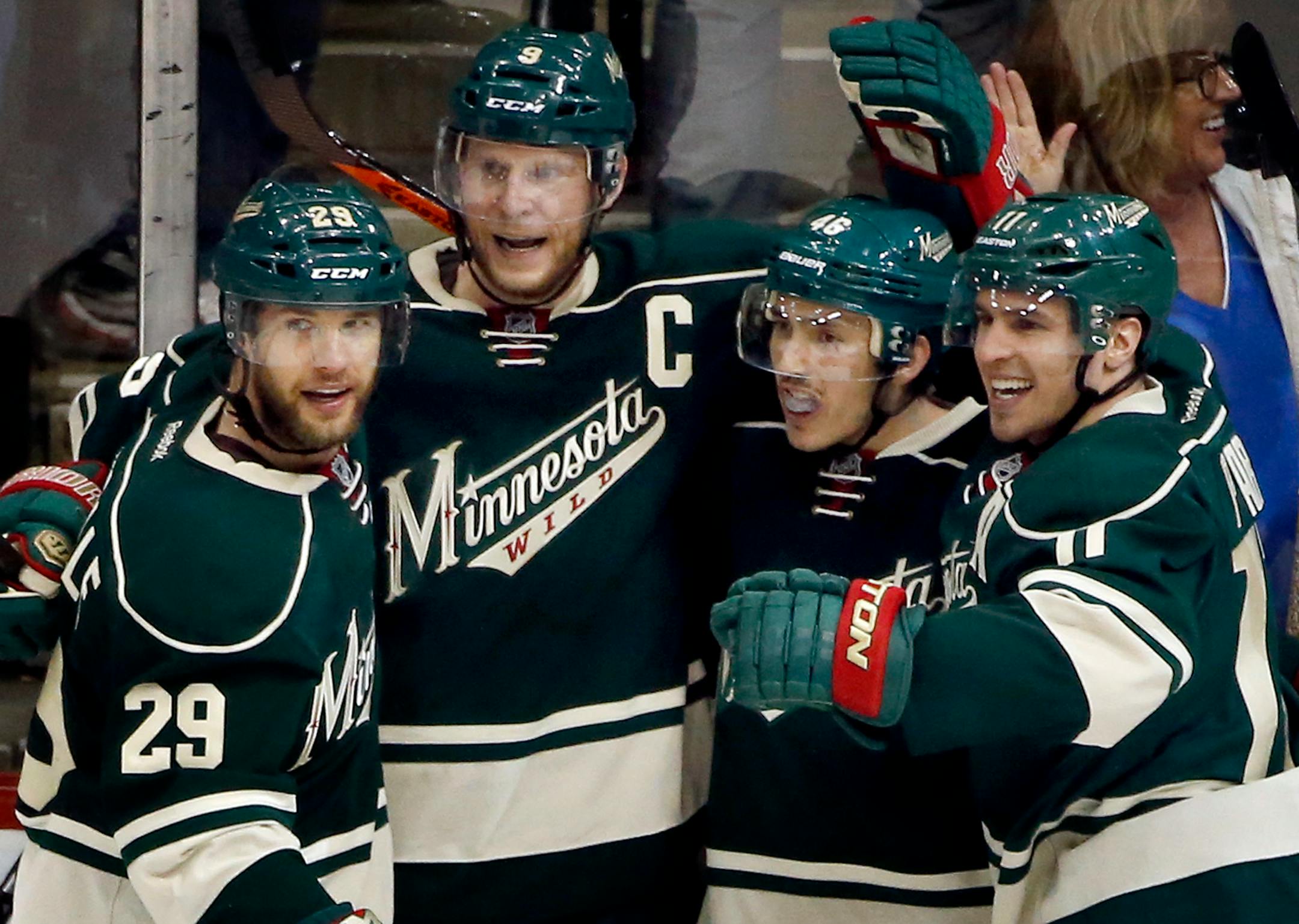 Jared Spurgeon (46) celebrated with teammates after scoring a goal in the third period. - May 9, 2014, St. Paul, Minn., Xcel Energy Center, NHL, Minnesota Wild vs. Chicago Blackhawks, Stanley Cup Playoffs Round 2, Game 4