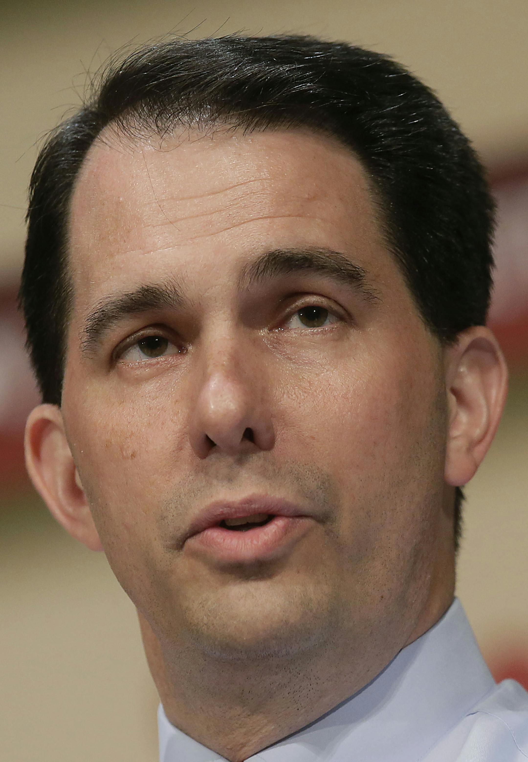 FILE -- Wisconsin Gov. Scott Walker speaks during The Family Leadership Summit in Ames, Iowa, July 18, 2015. Though most of the presidential candidates have spent time for months in early primary states, on paper, they have only just recently spent money campaigning, a practice both defended and called into question. (Joshua Lott/The New York Times) ORG XMIT: MIN2015080113261608