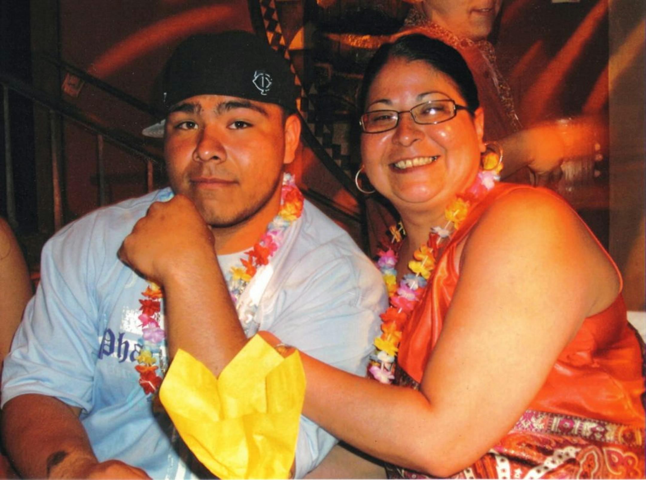 Champlin Park football player Michael Thomas and his mom, Dionne, who died last year.
