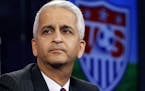 FILE - This Oct. 10, 2014, file photo shows Sunil Gulati, president of the United States Soccer Federation, during a press conference in Bristol, Conn